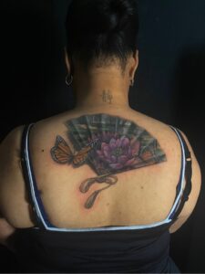 coverup tattoo lotus flower fan
