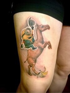 cowboy minion riding a camel color tattoo sticker